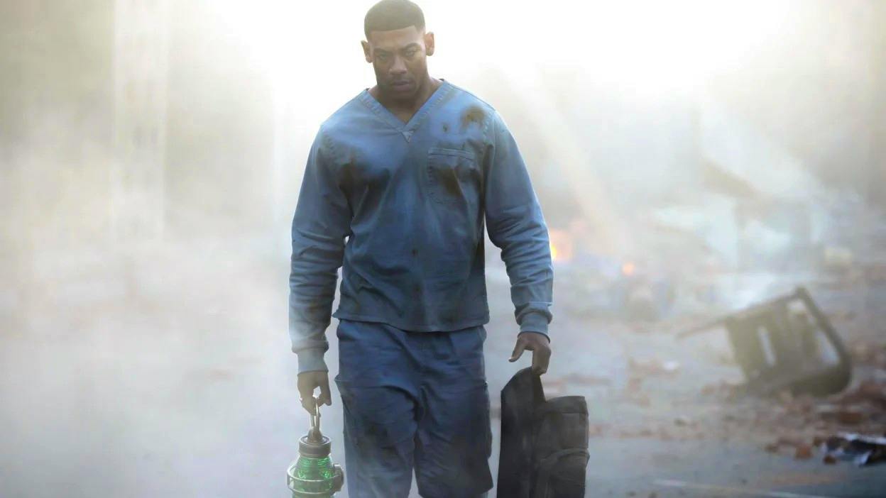 John Stewart, holding the Lantern, walking towards us through the smoke